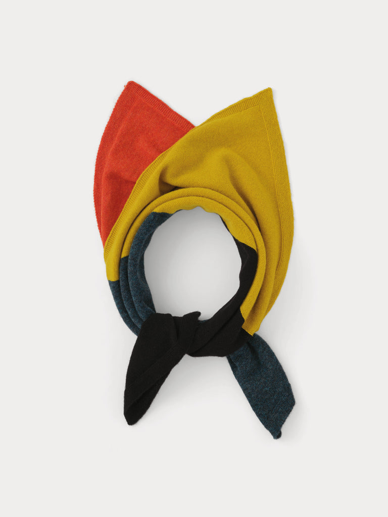 orange, yellow, black and grey square scarf tied in a knot