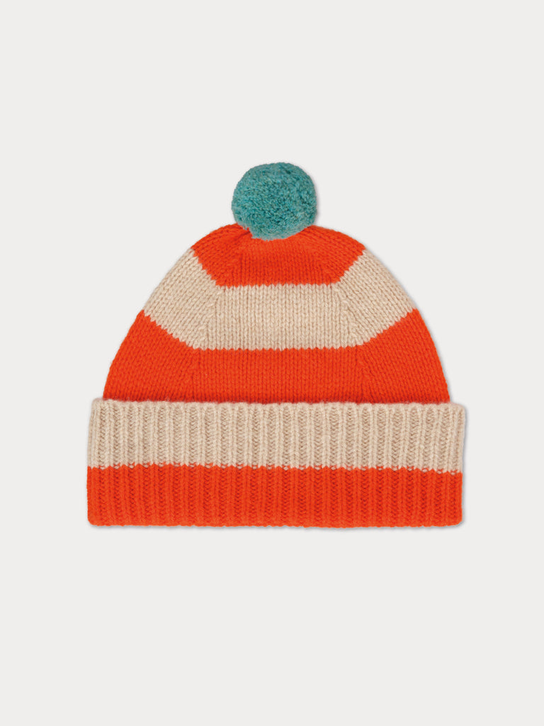 orange and cream striped beanie with blue pompom