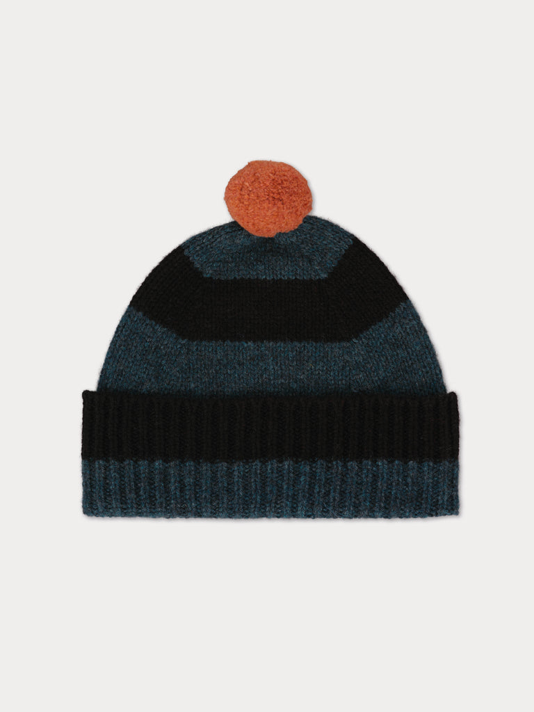blue and black striped beanie with pinky orange pompom