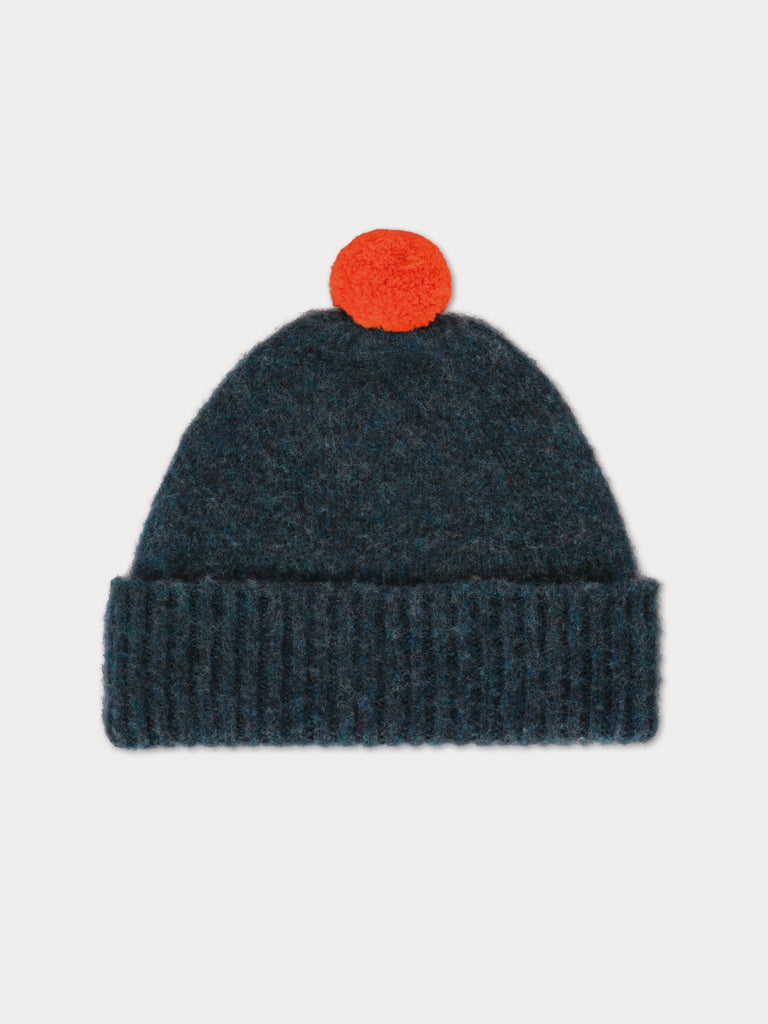 blue beanie with orange pompom