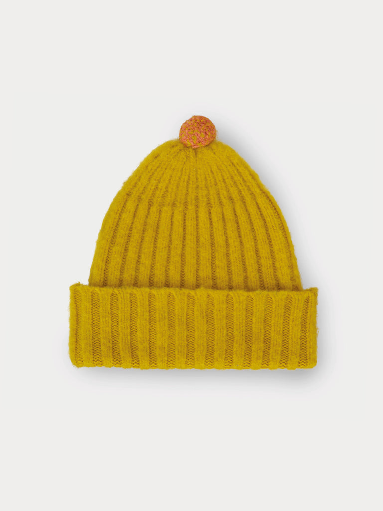 yellow beanie with yellow and orange speckled pompom