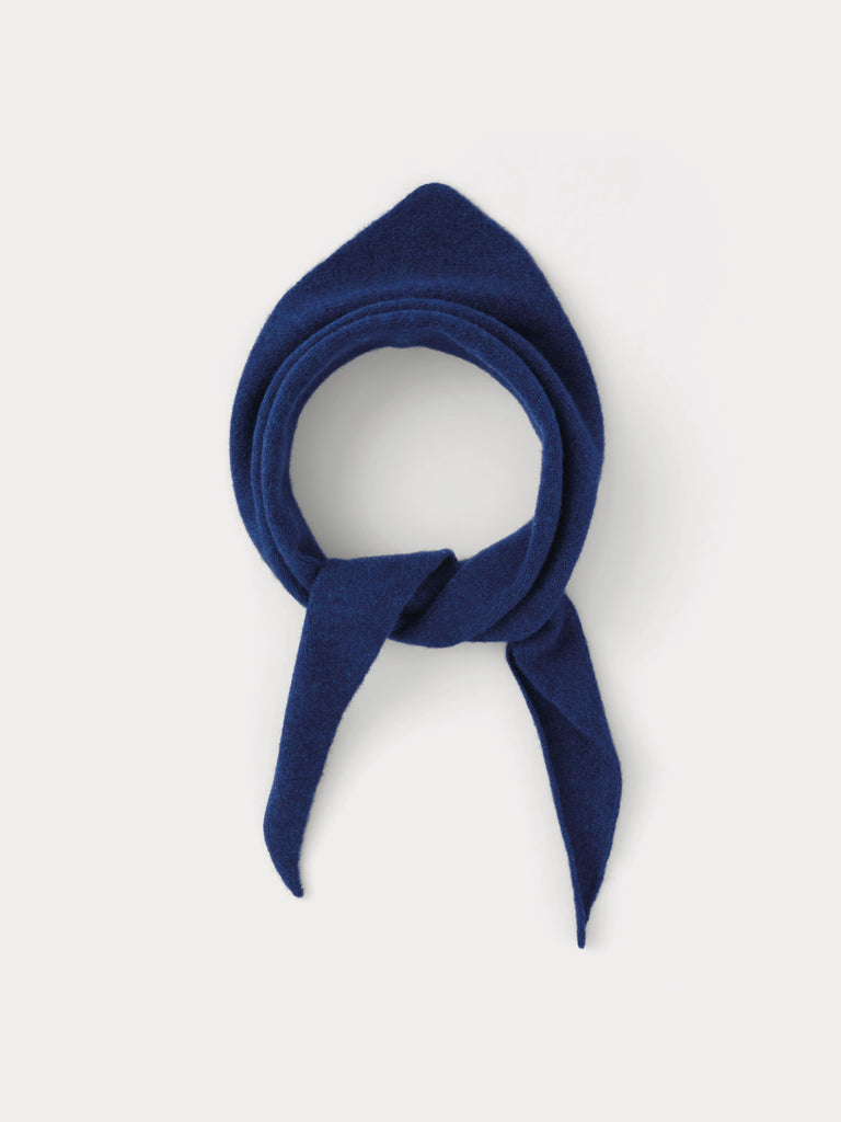 Navy blue triangle scarf tied into a knot